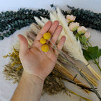 pampas grass laid out with silk flower